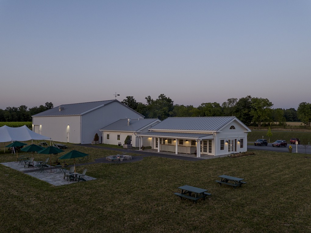 A view of the Warehouse, Office Building and Tasting Room from the southwest at dusk.